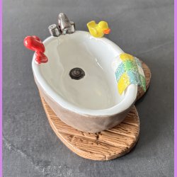 Badekar med badeand og t�fler