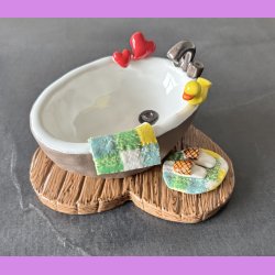 Badekar med badeand og t�fler