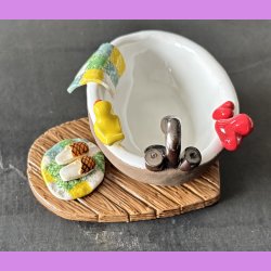 Badekar med badeand og t�fler